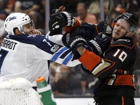 Winnipeg Jets defenseman Ben Chiarot (7) tangles with Anaheim Ducks right wing Corey Perry (10) during the second period of an NHL hockey game in Anaheim, Calif., Friday, Nov. 24, 2017. (AP Photo/Alex Gallardo) ORG XMIT: ANA106