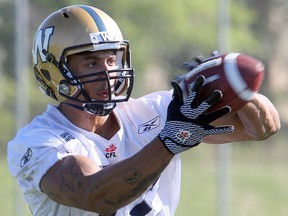 Winnipeg Blue Bombers wide receiver Jordan Reaves grabs a pass during CFL football practice in Winnipeg, Man. Sunday May 31, 2015. Brian Donogh/Winnipeg Sun/Postmedia Network