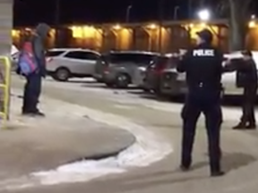 Winnipeg police use a Taser on a man outside a Tim Hortons in the 100 block of Isabel Street on Wednesday. Facebook