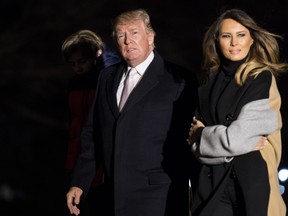 U.S. President Donald Trump and First Lady Melania Trump return to the White House following a weekend trip to Mar-a-Lago, on the South Lawn of the White House on January 15, 2018 in Washington, D.C. (Kevin Dietsch-Pool/Getty Images)