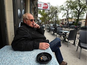 Mario smokes a cigarette on a patio at Bar Italia on Corydon Avenue in Winnipeg on Wed., May 17, 2017. Kevin King/Winnipeg Sun/Postmedia Network