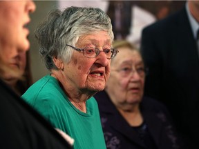 Senior citizens Margaret Topham (centre) and Jean Feliksiak (right) speak with media about the cancellation of a Manitoba Housing subsidy at the Lions Housing Centre, during an event arranged by the NDP at the Manitoba Legislative Building on Monday.