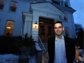 Michael Champagne poses in front of Government House in Winnipeg on Tuesday, where he was to be presented with a Governor's General Award for outstanding Indigenous leadership.