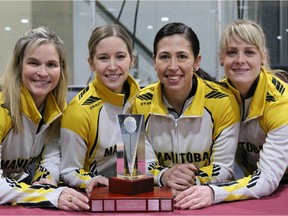 Jennifer Jones team of (left to right) skip Jennifer Jones, third Kaitlyn Lawes, second Jill Officer and lead Dawn McEwen hold trophy for winning Manitoba curling championship on Sunday. Jones has won her record eighth Manitoba women's curling championship, with a last-rock, 7-6 victory over Darcy Robertson.