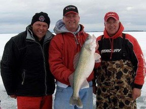 (Left to right) Craig Stapon, Dave Randash and Jay Kulla with a 31-inch fish caught with a buck-shot spoon lure.