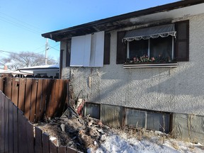 A house on the 400 block of Victoria Avenue West in Transcona is boarded up on Sunday after a fire broke out there early Saturday evening.