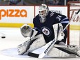 Winnipeg Jets goaltender Michael Hutchinson eyes a Tampa Bay Lightning shot in Winnipeg on Tuesday, Jan. 30. The 28-year-old signed a one-year, one-way deal with the Florida Panthers on Sunday.