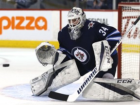 Winnipeg Jets goaltender Michael Hutchinson eyes a Tampa Bay Lightning shot in Winnipeg on Tues., Jan. 30, 2018. Kevin King/Winnipeg Sun/Postmedia Network