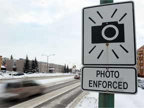 A photo radar sign is seen on Grant Avenue near Wilton in Winnipeg, Man. Tuesday Feb. 05, 2013. Speeding infractions in the area have gone down 71% in the last year. BRIAN DONOGH/WINNIPEG SUN/QMI AGENCY ORG XMIT: POS1607240133203606