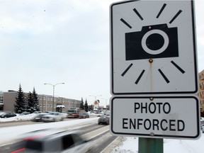 A photo radar sign is seen on Grant Avenue near Wilton in Winnipeg, Man. Tuesday Feb. 05, 2013. Speeding infractions in the area have gone down 71% in the last year.