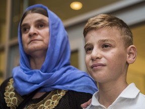 Nofa Mihlo Rafo (left) is reunited with her son Emad Mishko Tamo at Winnipeg's James Armstrong Richardson International Airport on Thursday August 17, 2017. Emad Mishko Tamo was rescued by Iraqi forces in July, after being held captive by ISIL for the past three years.