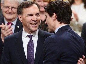 Finance Minister Bill Morneau is congratulated by Prime Minister Justin Trudeau after delivering the Finance Minister Bill Morneau is congratulated by Prime Minister Justin Trudeau after delivering the federal budget in the House of Commons in Ottawa on Tuesday, Feb.27, 2018. THE CANADIAN PRESS