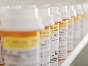 Bottles of pills arranged in shelf at a drugstore