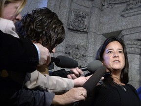 Minister of Justice and Attorney General of Canada Jody Wilson-Raybould speaks to reporters in the Foyer of the House of Commons on Parliament Hill in Ottawa on Monday, Feb. 12, 2018. THE CANADIAN PRESS/Justin Tang ORG XMIT: JDT105