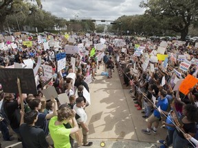 Students gather on the steps of the old Florida Capitol protesting gun violence in Tallahassee, Fla., Wednesday, Feb. 21, 2018.