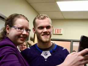 Melissa Ferens (left) and Winnipeg Jets forward Nikolaj Ehlers pose for a selfie after Ehlers delivered a box of doughnuts from Oh Doughnuts through Skip The Dishes on Wednesday, Feb. 7, 2017. Scott Billeck/Postmedia