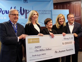 From L to R: DASCH chair Jack Mutter and DASCH CEO Karen Fonseth along Nancy, Dana and Peter Jessiman hold up a $1 million donation for DASCH's Double up for DASCH campaign on Thursday, Feb. 15 in Winnipeg. Scott Billeck/Postmedia
