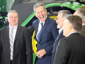 J R Simplot announced today the company will invest $460 million to expand it's Portage la Prairie operation. RM of Portage Reeve Kam Blight (left) and Manitoba Premier Brian Pallister (second from left) are all smiles following Wednesday morning's announcement. 
Brian Oliver/Postmedia