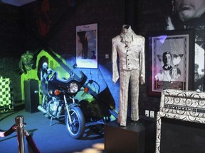 In this Nov. 2, 2016 file photo, a Prince costume and motorcycle are on display at Prince's Paisley Park in Chanhassen, Minn.
