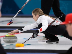 Canada's Kaitlyn Lawes throws the stone during their mixed doubles curling match against China at the 2018 Winter Olympics.