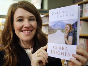 Olympic athlete Clara Hughes displays her new book "Open Heart, Open Mind" in Winnipeg, Man. Tuesday September 15, 2015. Brian Donogh/Winnipeg Sun/Postmedia Network