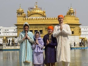 Prime Minister Justin Trudeau wife Sophie Gregoire Trudeau, and children, Xavier, 10, Ella-Grace, 9, visit the Golden Temple in Amritsar, India on Wednesday, Feb. 21, 2018.