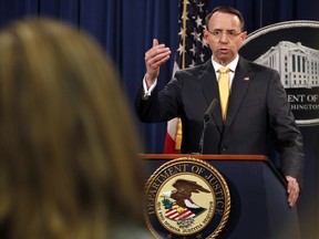 Deputy Attorney General Rod Rosenstein answers a question after announcing that the office of special counsel Robert Mueller announced a grand jury has charged 13 Russian nationals and several Russian entities, Friday, Feb. 16, 2018, in Washington. (AP Photo/Jacquelyn Martin)