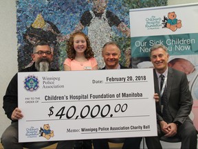 Winnipeg Police Assocation vice-president George Vanmackelbergh (from left), 2018 Champion Child, Abigail Stewart; Moe Sabourin, WPA president, Gary Rozak, CHF acting president and CEO.  
Bob Holliday/Winnipeg Police Association Handout