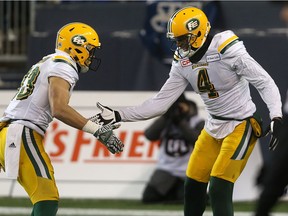 Edmonton Eskimos SB Adarius Bowman (right) celebrates one of his two touchdown catches during the CFL West semifinal against the Winnipeg Blue Bombers in November.