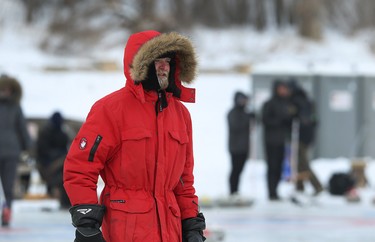 A competitor is bundled up for the 17th annual Ironman Outdoor Curling Bonspiel on the Red River at The Forks in Winnipeg on Sun., Feb. 4, 2018. Kevin King/Winnipeg Sun/Postmedia Network