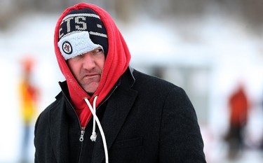 A competitor eyes his shot during the 17th annual Ironman Outdoor Curling Bonspiel on the Red River at The Forks in Winnipeg on Sun., Feb. 4, 2018. Kevin King/Winnipeg Sun/Postmedia Network