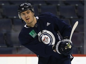 Mark Scheifele shoots during Winnipeg Jets practice at Bell MTS Place in Winnipeg on Mon., Feb. 5, 2018. Scheifele is nearing return from a shoulder injury. Kevin King/Winnipeg Sun/Postmedia Network