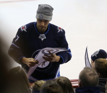 Ben Chiarot signs autographs during the Winnipeg Jets skills competition at Bell MTS Place in Winnipeg on Wed., Feb. 14, 2018. Kevin King/Winnipeg Sun/Postmedia Network