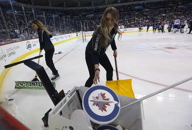 Members of the Ice Crew discard broken targets from the accuracy event at the Winnipeg Jets skills competition at Bell MTS Place in Winnipeg on Wed., Feb. 14, 2018. Kevin King/Winnipeg Sun/Postmedia Network