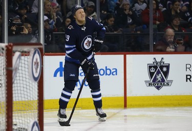 Patrik Laine pretends to be a blind passer during the accuracy event at the Winnipeg Jets skills competition at Bell MTS Place in Winnipeg on Wed., Feb. 14, 2018. Kevin King/Winnipeg Sun/Postmedia Network