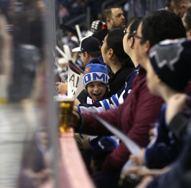 A young fan is excited about the Winnipeg Jets skills competition at Bell MTS Place in Winnipeg on Wed., Feb. 14, 2018. Kevin King/Winnipeg Sun/Postmedia Network
