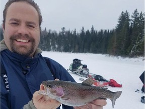Justin Stapon with a camp rainbow trout.