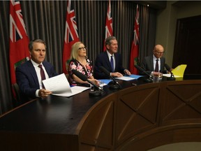 From the left; Finance Minister Cameron Friesen, Rochelle Squires, minister responsible for the status of women, Manitoba Premier Brian Pallister, and Fred Meier, clerk of the executive, during a news conference, where steps to promote a safe work environment were announced Thursday.