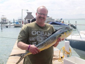 Mark Mercier with a mahi mahi, caught in Cancun, Mexico.
