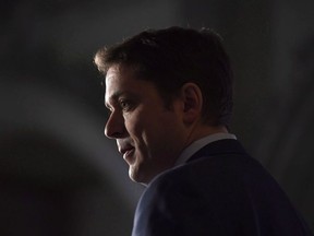 Conservative Leader Andrew Scheer speaks to reporters during a media availability on Parliament Hill in Ottawa on Tuesday, Feb. 6, 2018. Scheer is off to London to start laying the groundwork for his pledge to negotiate a free trade agreement with the United Kingdom should he become prime minister.