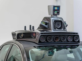This photo taken on September 13, 2016 shows the cameras on a pilot model of an Uber self-driving car at the Uber Advanced Technologies Center in Pittsburgh, Pennsylvania.