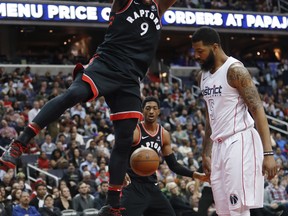 Toronto Raptors forward Serge Ibaka dunks the ball against the Washington Wizards on Friday night. (AP PHOTO)