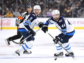 Josh Morrissey and Jacob Trouba will be reunited on Saturday night against the Toronto Maple Leafs. Trouba returns from a five-game layoff due to a concussion. (Photo by Harry How/Getty Images)