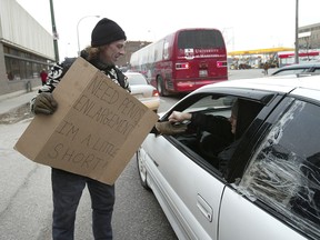 Creative signs might be entertaining, but a reader says panhandling in traffic should be illegal.