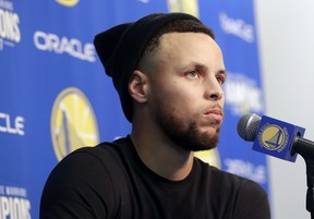 Golden State Warriors guard Stephen Curry speaks at a news conference on Sunday. (AP PHOTO)