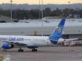 A Thomas Cook aircraft is pictured at Manchester airport. PAUL ELLIS/AFP/Getty Images)