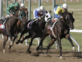 Alan Cuthbertson rides Matt's Broken Vow during the first lap of the 60th Running of the Manitoba Lotteries Derby at Assiniboia Downs.n/a