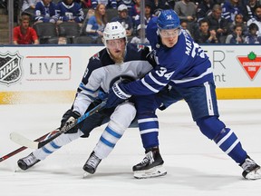 TORONTO, ON - MARCH 31:  Patrik Laine #29 of the Winnipeg Jets skates against Auston Matthews #34 of the Toronto Maple Leafs during an NHL game at the Air Canada Centre on March 31, 2018 in Toronto, Ontario, Canada. (Photo by Claus Andersen/Getty Images)