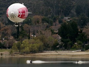 A blimp tows waterskiers on Lake Elsinore, Calif., on Tuesday, March 13, 2018. (Terry Pierson/Los Angeles Daily News via AP)