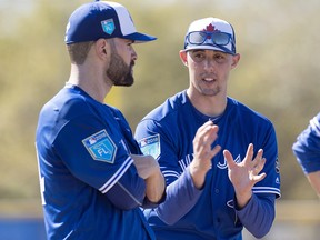 Toronto Blue Jays pitchers Aaron Sanchez (right) and Jaime Garcia discuss workout posture at spring training in Dunedin, Fla. on Sunday, February 18, 2018. (THE CANADIAN PRESS/Frank Gunn)